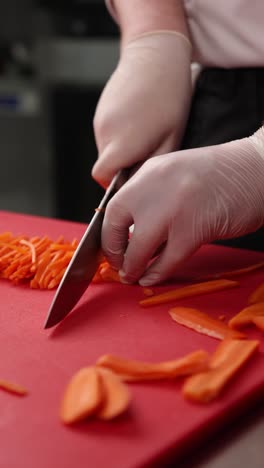 chef chopping carrots