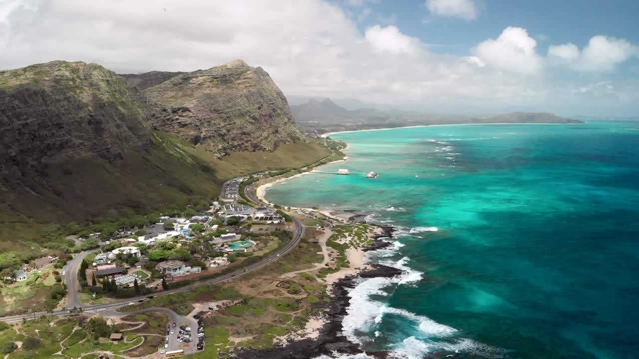 Version One. Timelapse Aerial over Makapu'u Beach and Makapu'u Lookout with Beautiful Ocean, Clouds, Cliffs and Cars in Oahu, Hawaii