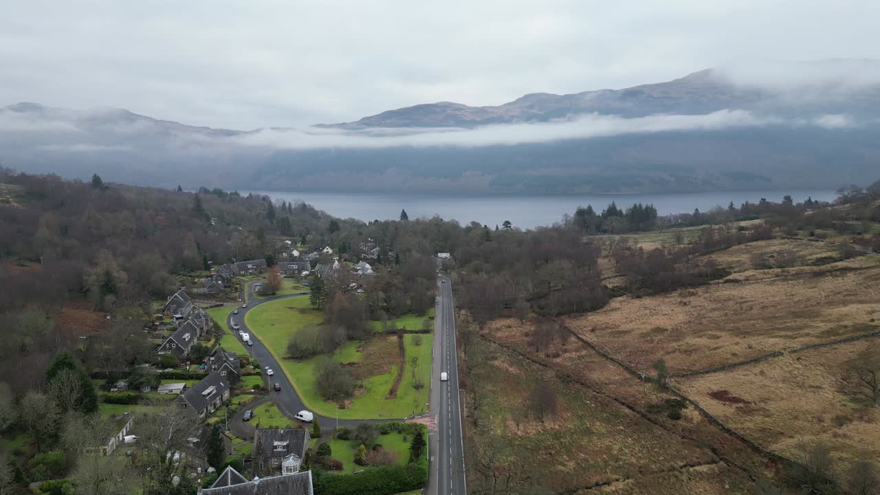 Aerial Push In On Arrochar, Tarbet With Mountains Surrounding