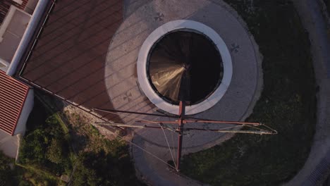 Top-down-shot-of-traditional-Odeceixe-Mill-during-sunrise-at-Portugal,-aerial