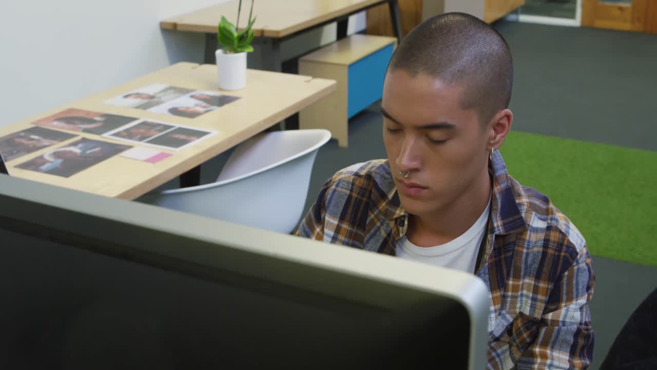 Young man working in a creative office