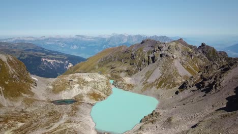 drone shot of the green wildsee in pizol, in the glarus alps, st. gallen, switzerland