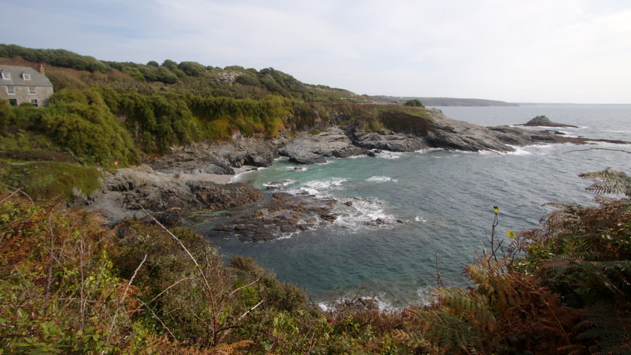 Extra Wide shot of the sea and rocks at Bessy's Cove, The Enys taken from the Coastal path, cornwall