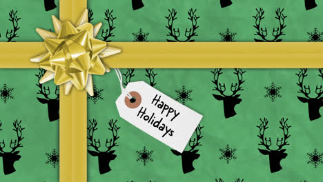 Animation-of-ribbons-and-abstract-changing-shapes-and-happy-holidays-text-on-gift-box