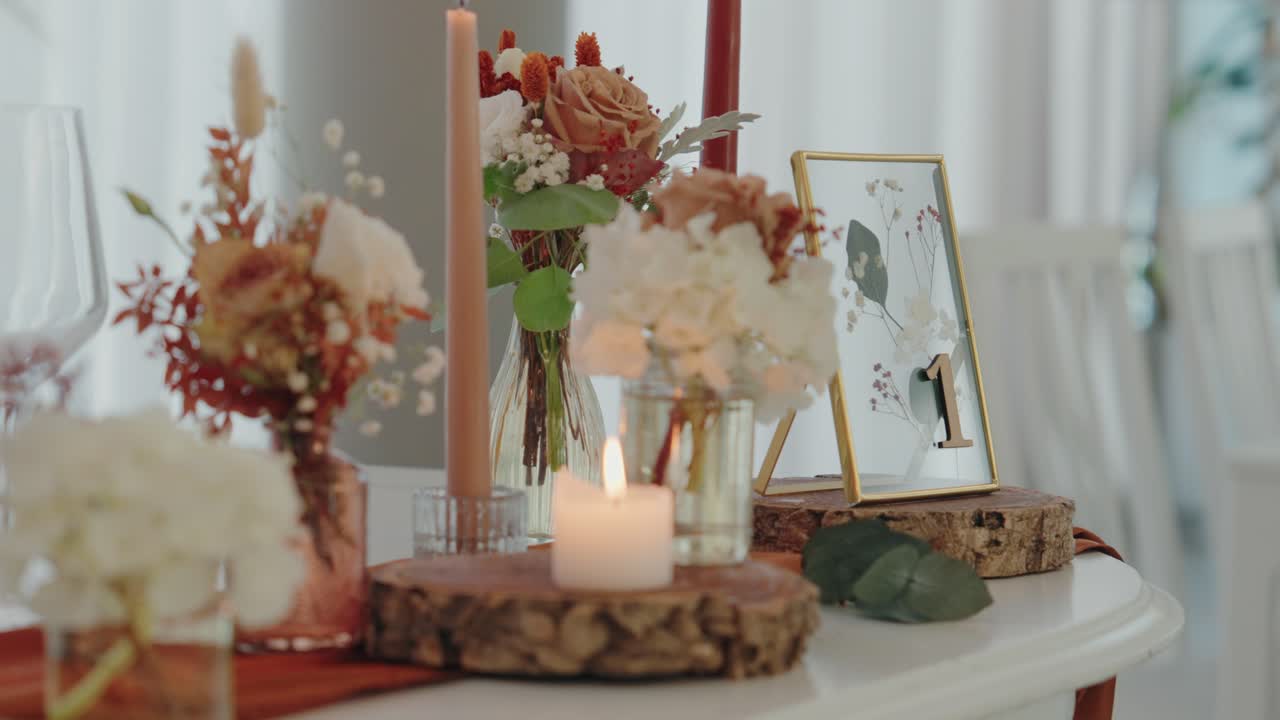 delicate flowers and candle centerpieces on a romantic wedding table