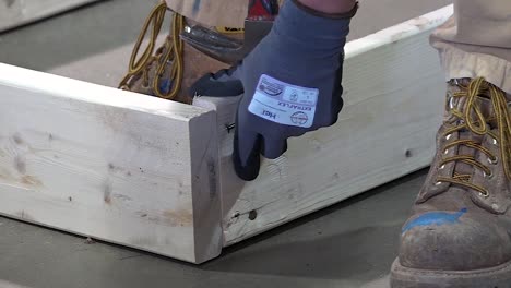 carpenter hamming a nail