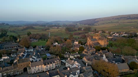 Aerial-footage-of-the-Medieval-village-of-Cartmel-in-the-English-Lake-District-it-has-a-rich-heritage,-and-varied-list-of-activities-for-visitors-and-tourists