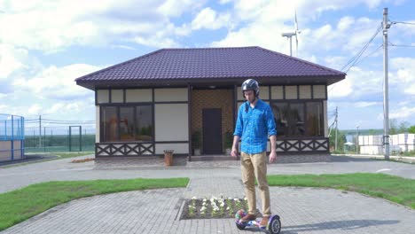 man on electric scooter in front of a house