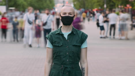 woman wearing a mask in a city street