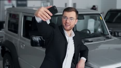 stylish young man takes a selfie video on the phone