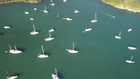 sailboats anchored in bay from the air caribbean island drone