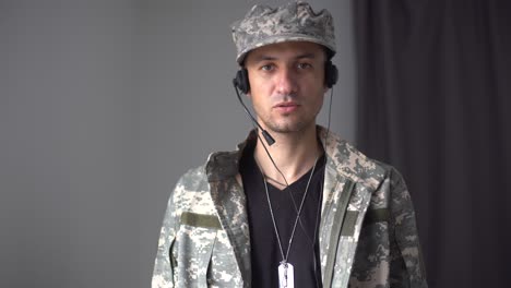 portrait of a man in military fatigues, face to camera