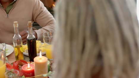 African-american-parents,-children-and-grandparents-celebrating-at-thanksgiving-dinner,-slow-motion