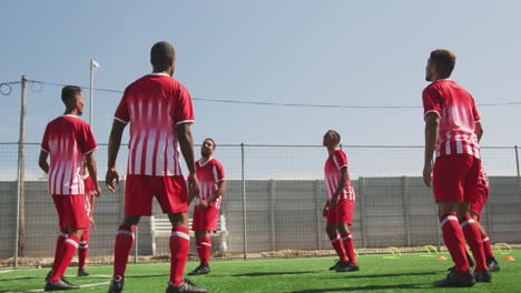 Soccer-players-training-on-field