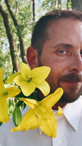 man with yellow lilies