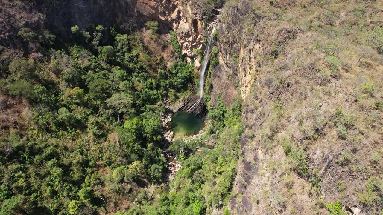 Aerial View of Stunning Waterfall in Lush Green Forest