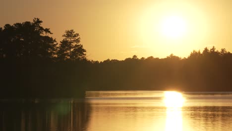 beautiful and dramatic sunset reflected in atsion lake, new jersey, usa