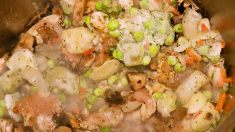 homemade steaming hot stew in the pot still cooking