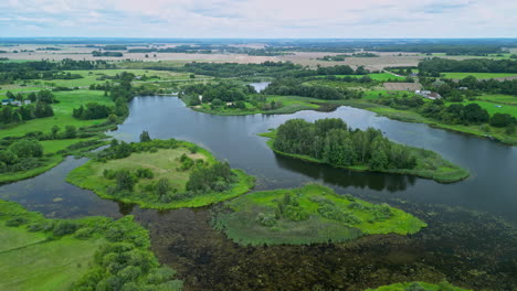 Small-lake-with-many-island-inside-in-Latvia,-aerial-drone-view