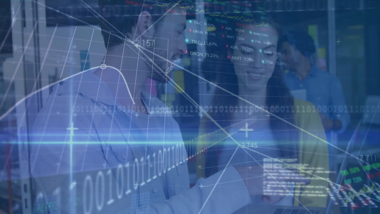 Analyzing digital graphs with animation, business professionals in office setting