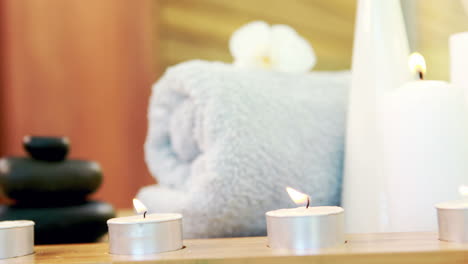 oil, towel, candles and stones