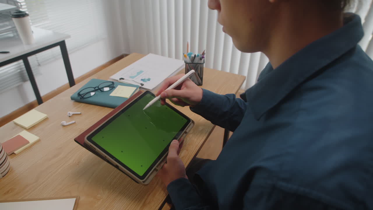 Male Graphic Designer Drawing Sketch on Tablet with Green Screen
