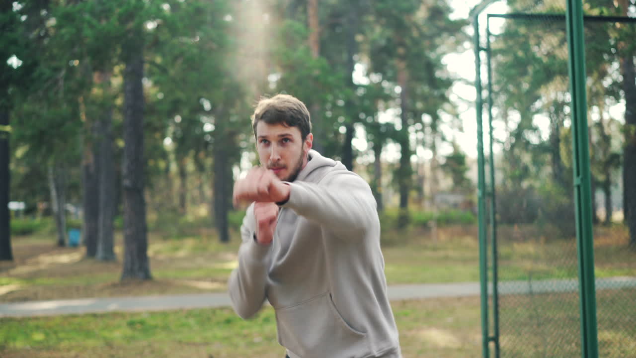 Man Boxing Training in a Park