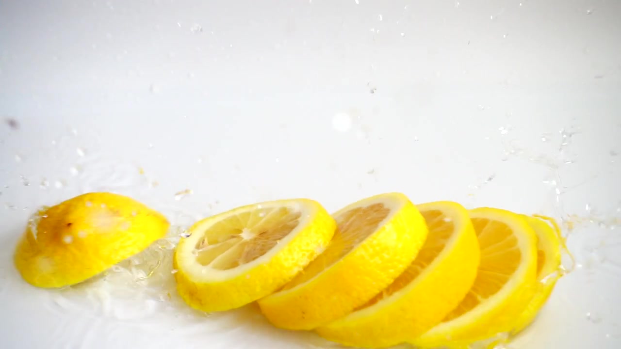 Falling of segments of a lemon. Slow motion.