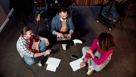 top view of musical group in the studio