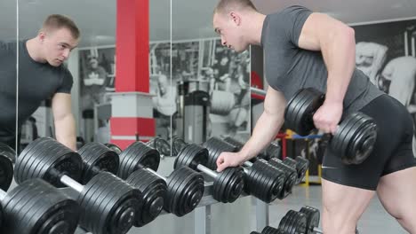 young man preforming dumbbell lateral raise – exercise for shoulders