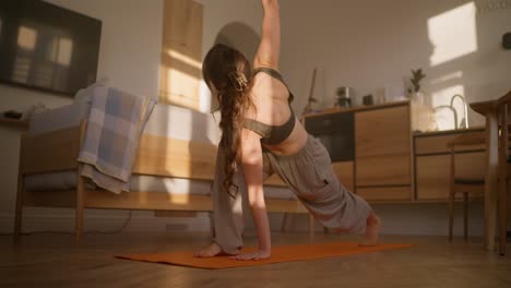 woman practicing yoga at home