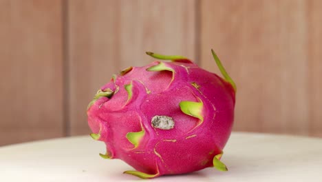 dragon fruit spins on a wooden table