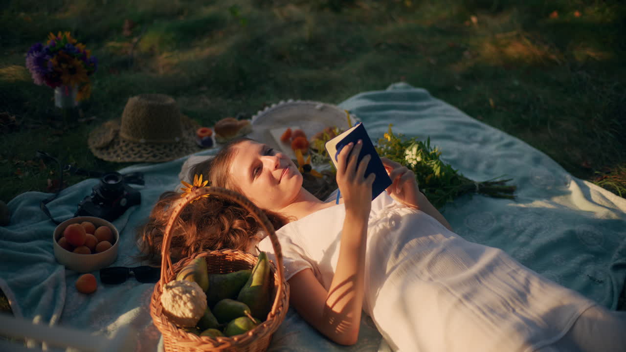 Tranquil girl on blanket in warm sunshine