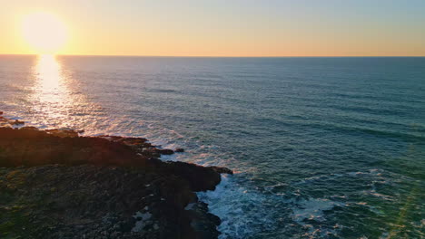 picturesque sunset summer ocean. aerial view sun rays reflecting in sea surface.