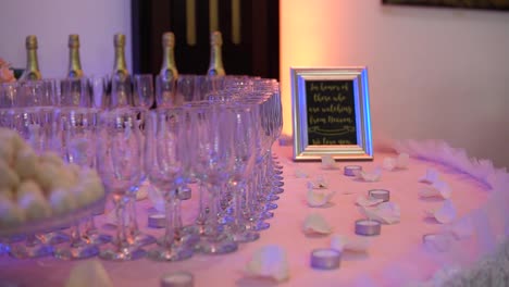 glasses and champagne in restaurant for bride, groom and guests
