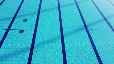 drone shot flying over costoli empty swimming pool due to coronavirus pandemic