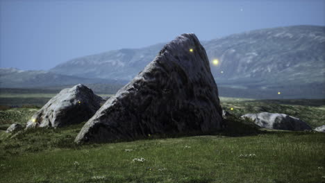 green meadow on the background of the mountains