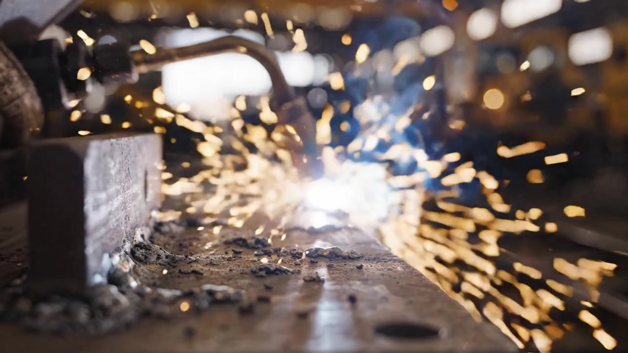 A Glimpse into Metalworking: Sparks Fly as the Torch Ignites the Steel, Showcasing the Art and Precision of Modern Welding Techniques in Action