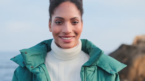 smiling african american girl looking at the camera.