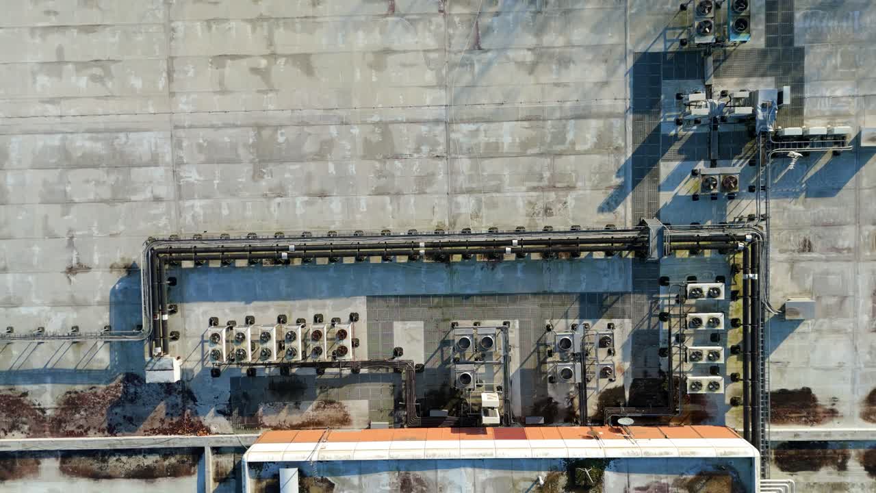 Close up aerial view of rotating ventilation fans and HVAC systems on a modern data centre rooftop