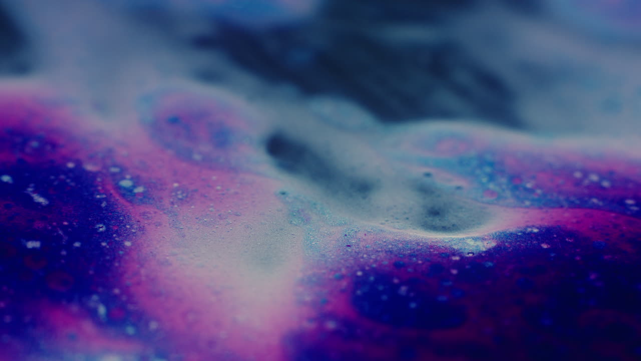 Colourful, organic, liquids macro shots buzzing and flowing