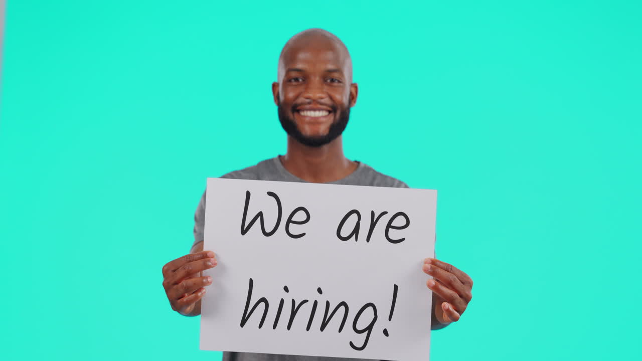 Black man, billboard and hiring sign