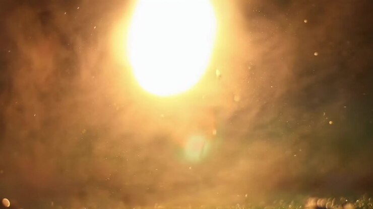 Ethereal Golden Light with Sparkling Dust and Bokeh Effect