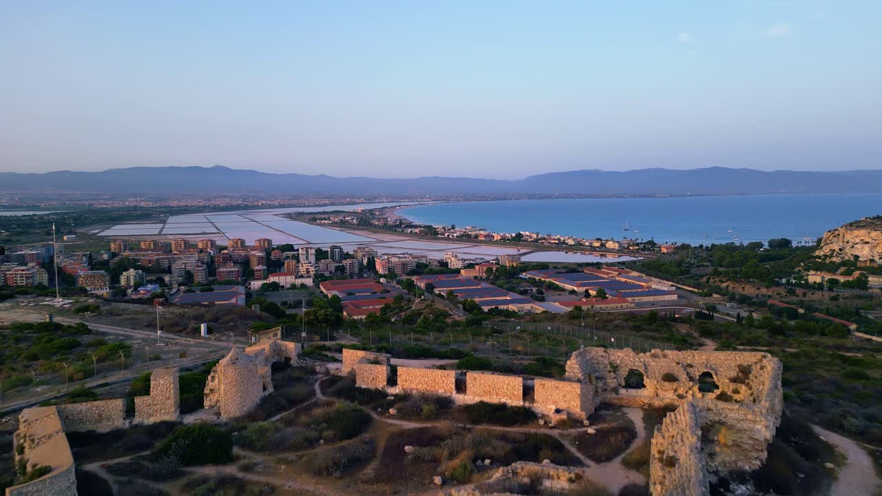 Sunrise on the Sardinian coast and Fortino di Sant'Ignazio landmark