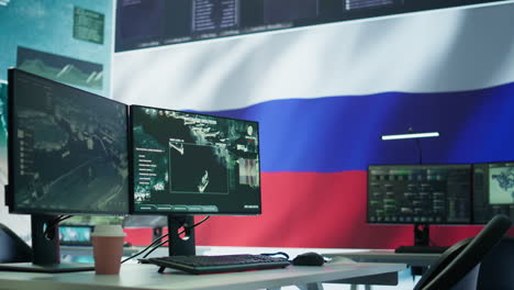 empty russian military control center with a big screen presenting the national flag