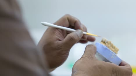 closeup shot for a technician preparing a denture