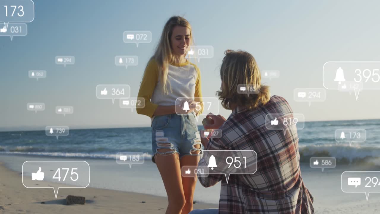 해변에서 여자친구에게 청혼하는 남자에 대한 소셜 미디어 아이콘의 애니메이션