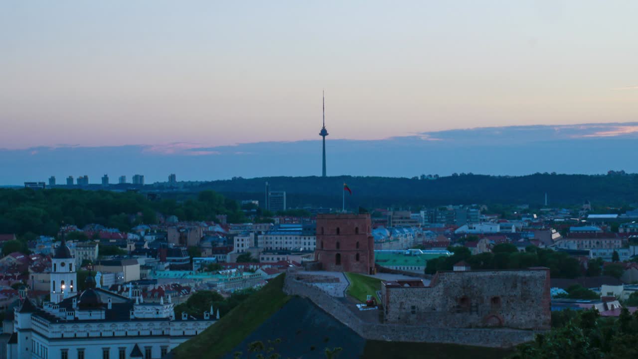 Vilnius Gediminas Castle and Vilnius Television tower in the distance in sunset shot