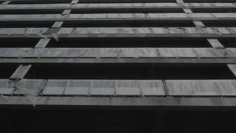Tilt-up camera movement revealing a building under construction