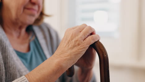 elderly woman using a walking cane